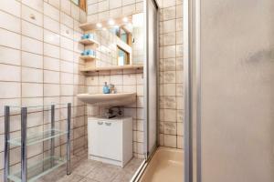 a small bathroom with a sink and a shower at Kranichnest in Lüdershagen +24 photos