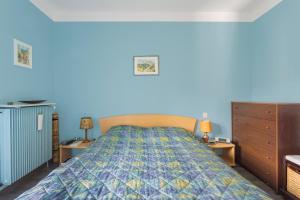 a bedroom with a bed and two night stands at Sun Canigou in Vernet-les-Bains