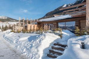 a log cabin in the snow at Aura Chalets - Nr 3 in Castelrotto