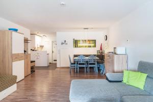 a living room with a couch and a table at Ferienwohnung Ursel in Todtmoos