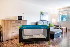 a play set in a living room with a couch at Ferienwohnung Ursel in Todtmoos