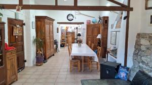 a dining room with a table and some chairs at Chambres D'hôtes Le Bellevue - in Montbrun-les-Bains