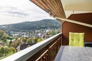 a balcony with a view of a town at Ferienwohnung Ursel in Todtmoos +15 photos