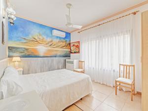 a bedroom with a bed and a painting on the wall at El Bosque in Llucmajor +17 photos