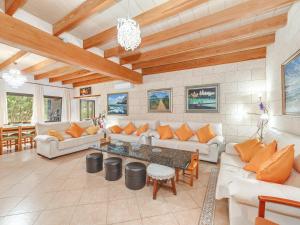 a living room with couches and a table at El Bosque in Llucmajor