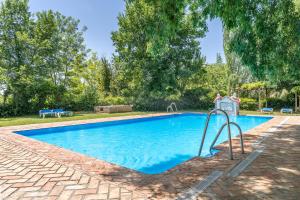 a swimming pool with a slide in a yard at Apartamento El Tinao in La Zubia