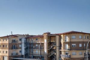 a row of apartment buildings in a city at Giuliano Superior para 4 personas in Empuriabrava