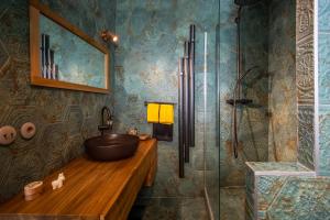 a bathroom with a sink and a shower at Le Topaze in Grimaud +13 photos