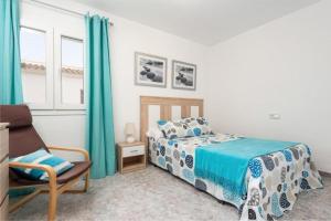 a bedroom with a bed and a chair at Can Navarro in Llucmajor +22 photos