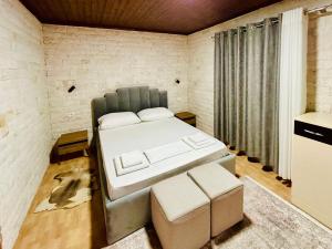 a bedroom with a bed in a room at Siera Home in Berat