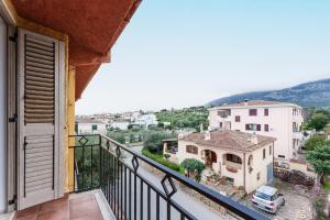 a balcony with a view of a city at Enjoy The Silence Flat in Orosei
