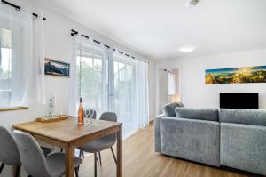 a living room with a couch and a table at Apartment Jegle in Salem