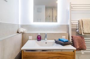 a bathroom with a sink and a mirror at Apartment Jegle in Salem +23 photos