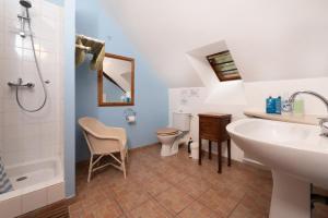 a bathroom with a sink and a tub and a toilet at Les gîtes Bretons in Bieuzy-les Eaux +42 photos