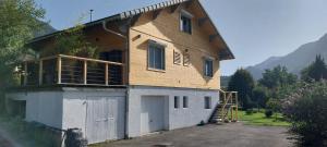 a house is being built with a garage at Gite Cairn, Rez De Chalet in Faverges