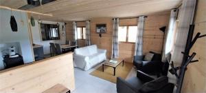 a living room in a tiny house at Gite Cairn, Rez De Chalet in Faverges