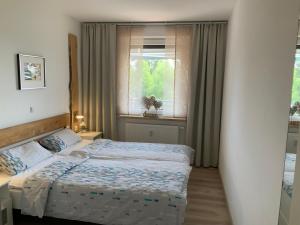 a bedroom with two beds and a window at Fuchsenstein 44 in Oberkreuzberg +35 photos