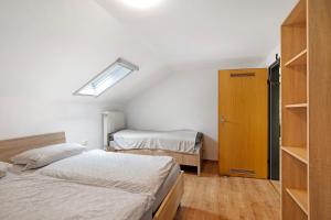 a small room with two beds and a closet at Ferienwohnung Dani in Koetz 