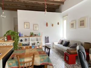a living room with a table and a couch at Reconnectar Malgrat de Mar Emili in Malgrat de Mar