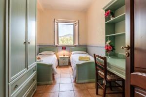 a bedroom with two beds and a window at Villa Filippa in Nicosia