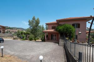 a driveway in front of a house with a fence at Villa Filippa in Nicosia