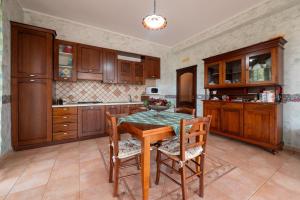 a kitchen with a table and chairs in a room at Villa Filippa in Nicosia +13 photos