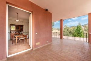 an empty patio with a table and chairs on a balcony at Villa Filippa in Nicosia