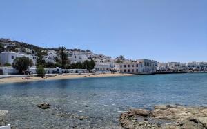 a view of a beach with white buildings at 5-Bed Stylish Maisonette in Mikonos