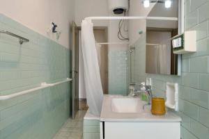 a bathroom with a sink and a shower at De Rolandis in Asti +12 photos
