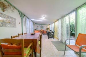 a dining room with a table and chairs at Chambres D'hôtes in Saint-Cyprien