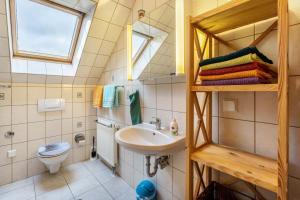 a small bathroom with a sink and a toilet at Haus im Grünen in Oederan +16 photos