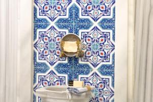 a bathroom with a blue and white tiled wall at Almina Guest House in Istanbul +45 photos