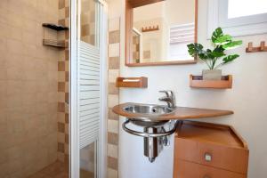 a bathroom with a sink and a mirror at Wonderful Villa Chrysta in Mikonos +27 photos