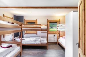 a group of bunk beds in a dorm room at The Farm in Westendorf