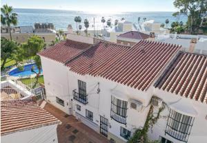an aerial view of a white house and the ocean at Burriana Casa Playa in Nerja