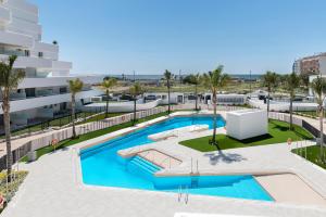 an overhead view of a swimming pool in a building at Horus 054 in Torre del Mar