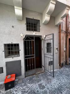 a building with a door with stars on it at Dammuso Cristoforo Colombo in Pantelleria