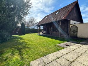 a house with a roof with a hose at Haus der Monteure in Stadtbergen