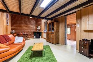 a living room with a couch and a table at La Cabane d'Ana in Bordeaux