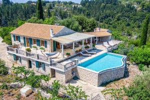 an aerial view of a house with a swimming pool at Villa Iremia Antipaxos in Antipaxos