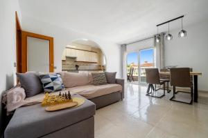 a living room with a couch and a table at Montserrat in Miami Platja