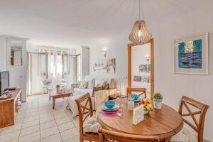a living room with a table and a couch at Mariners in Alcudia