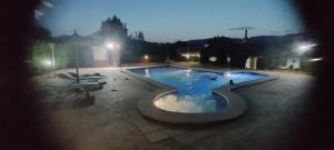 a swimming pool in a park at night at Agroturismo El Serrano in Moratalla