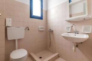 a bathroom with a toilet and a sink at Perasma Studios 7 in Kipri