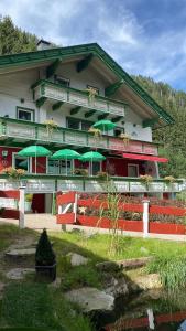a building with green umbrellas in front of it at Studio Pepper in Stall