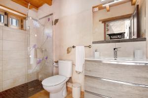 a bathroom with a toilet and a sink at Casa Rural Andresito in Pájara +19 photos