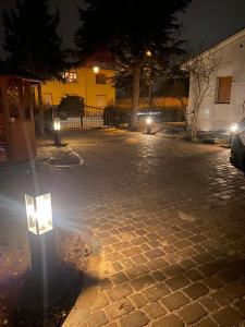 a street at night with lights on the ground at Villa Klitzeklein in Bad Belzig +2 photos