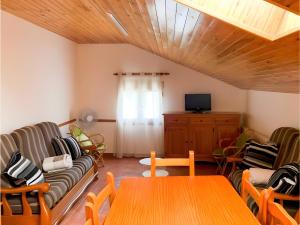 a living room with a couch and a table at Peña Yerga in Hospital