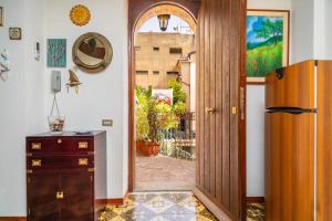 a room with a door with a view of a courtyard at Casa Florio in Taormina