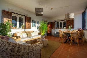 a living room with a couch and a table at House in Villa Torto in Monopoli